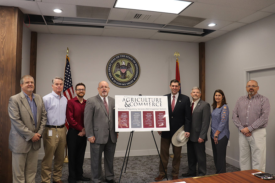 Pictured L-R: Brent Bowman, Director of MDAC’s Weights and Measures Division; Gene Robertson, Deputy Director of MDAC’s Bureau of Regulatory Services; Henri Fuselier, Jr., Director of MDAC’s Consumer Protection Division; Sid Salter, MSU Chief Communications Officer and Director; Commissioner Andy Gipson; Dr. Scott Boone, MSU Director of Petroleum Products; Jennifer Thompson, Director of MDAC’s Bureau of Regulatory Services; and Michael Blackwell, Director of MDAC’s Petroleum Division.