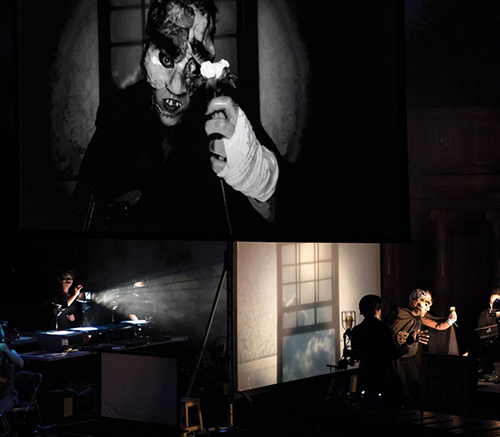 Photos from the set of "Frankenstein" performed by Manual Cinema