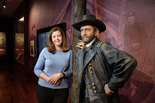 Anne Marshall is pictured by a life-size statue of Ulysses S. Grant inside the U.S. Grant Presidential Library at Mississippi State. 