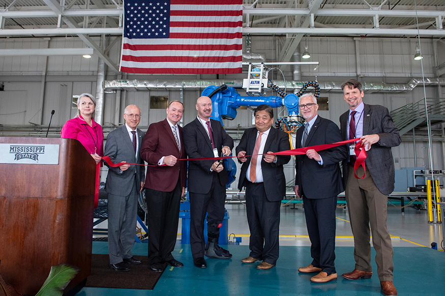 MSU, Boeing and NASA officials cut a ribbon to celebrate the opening of the Marvin B. Dow Stitched Composites Development Center at the university’s Advanced Composites Institute. Pictured, from left, are ACI Manager Tonia Lane, MSU Vice President for Research and Economic Development David Shaw, MSU President Mark E. Keenum, Raspet Flight Research Laboratory Director Dallas Brooks, Boeing Research & Technology Aeromechanics Technology Vice President Steve Yahata, NASA Langley Research Center Director David Bowles and ACI Director Dennis Smith. (Photo by Logan Kirkland)