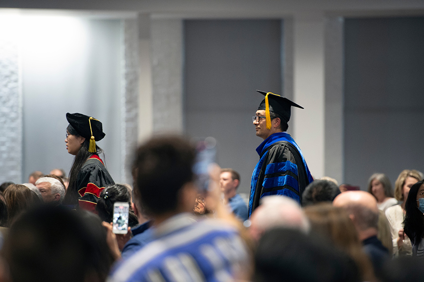 Ph.D. candidates arrive at the Doctoral Hooding Ceremony