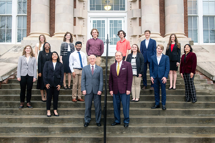 MSU Provost Scholars pictured with Provost and Executive Vice President David Shaw, front left, and MSU President Mark E. Keenum, front right, include: Row one (L to R): Umamah Amer; Will Davis; Row two (L to R): Kathryn Petersen; Jennifer Greer; Neil Sanipara; Jade Thompson; and Van Truong; and Row three (L to R): Olivia Draughn; Patricia Bethea; Noah Martin; Owen Smith; James Chalmers; and Annamarie Thompson. 
