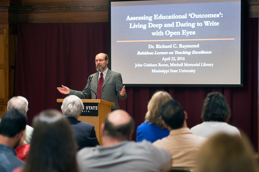 Richard Raymond, professor and head of Mississippi State’s Department of English, delivered the 2016 Rabideau Lecture for Teaching Excellence last week at Mitchell Memorial Library. The annual lecture honors Peter Rabideau, former MSU provost and founder of the Center for Teaching and Learning. During his presentation, Raymond discussed his personal experience in using writing assignments to keep students engaged and excited about learning. (Photo by Megan Bean)