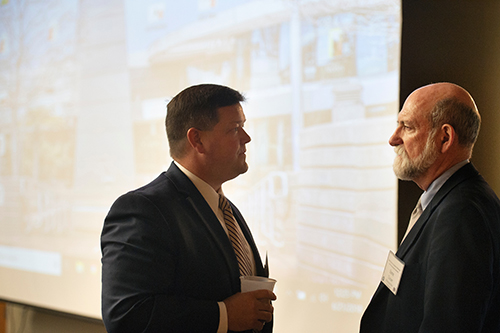 John Rounsaville, state director for the USDA Rural Development in Mississippi and MSU alumnus, and Steve Turner, director of the Southern Rural Development Center and MSU professor of agricultural economics, talk during the Rural Opportunity Initiative-Mississippi State University Rural Investment workshop on Thursday [June 21] at Mississippi State University. The event brought regional small business owners and investors together to discuss unique business opportunities in rural areas. (Photo by Megan Bean)