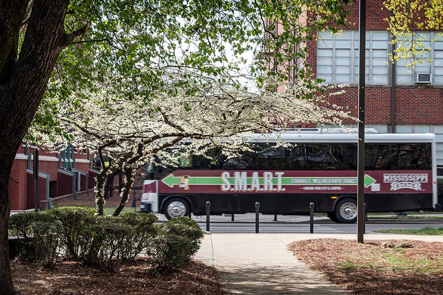 A SMART bus drives down Hardy Road on a spring day.