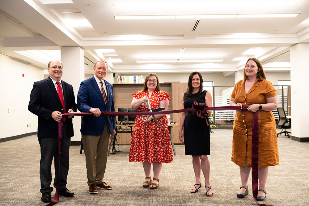 Mississippi State President Mark E. Keenum celebrates the ribbon cutting for the MSU Writing Center, now located on the second floor of Mitchell Memorial Library. 