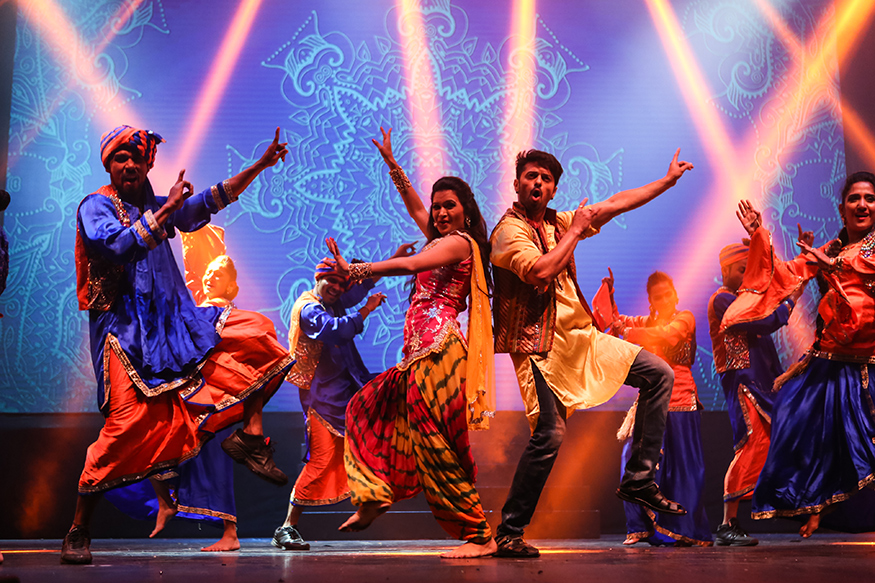 Members of the "Taj Express" showcase a colorful, high-energy Bollywood musical revue.