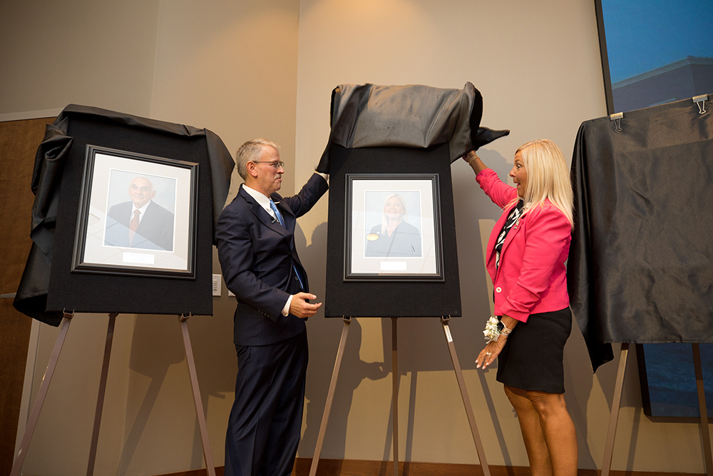 David Pittman and Patti Duett unveil a portrait for a career honor