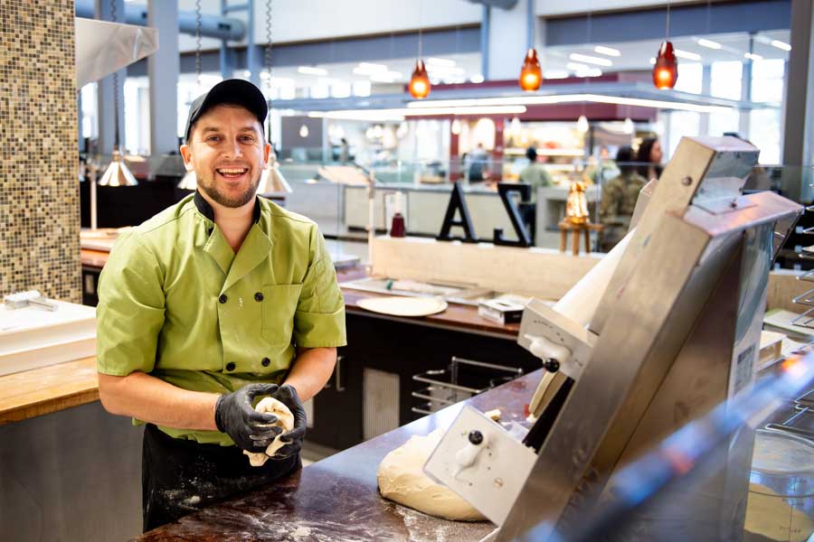 Vasyl Shramenko smiles at Fresh Food Co.