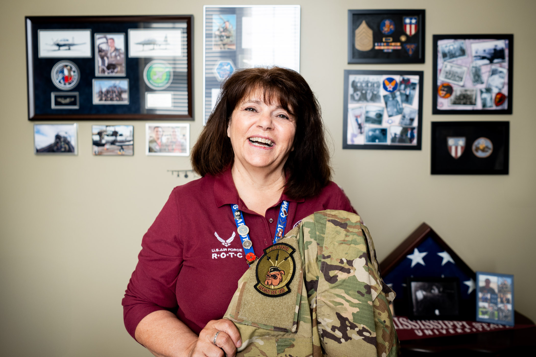 lady in front of photos