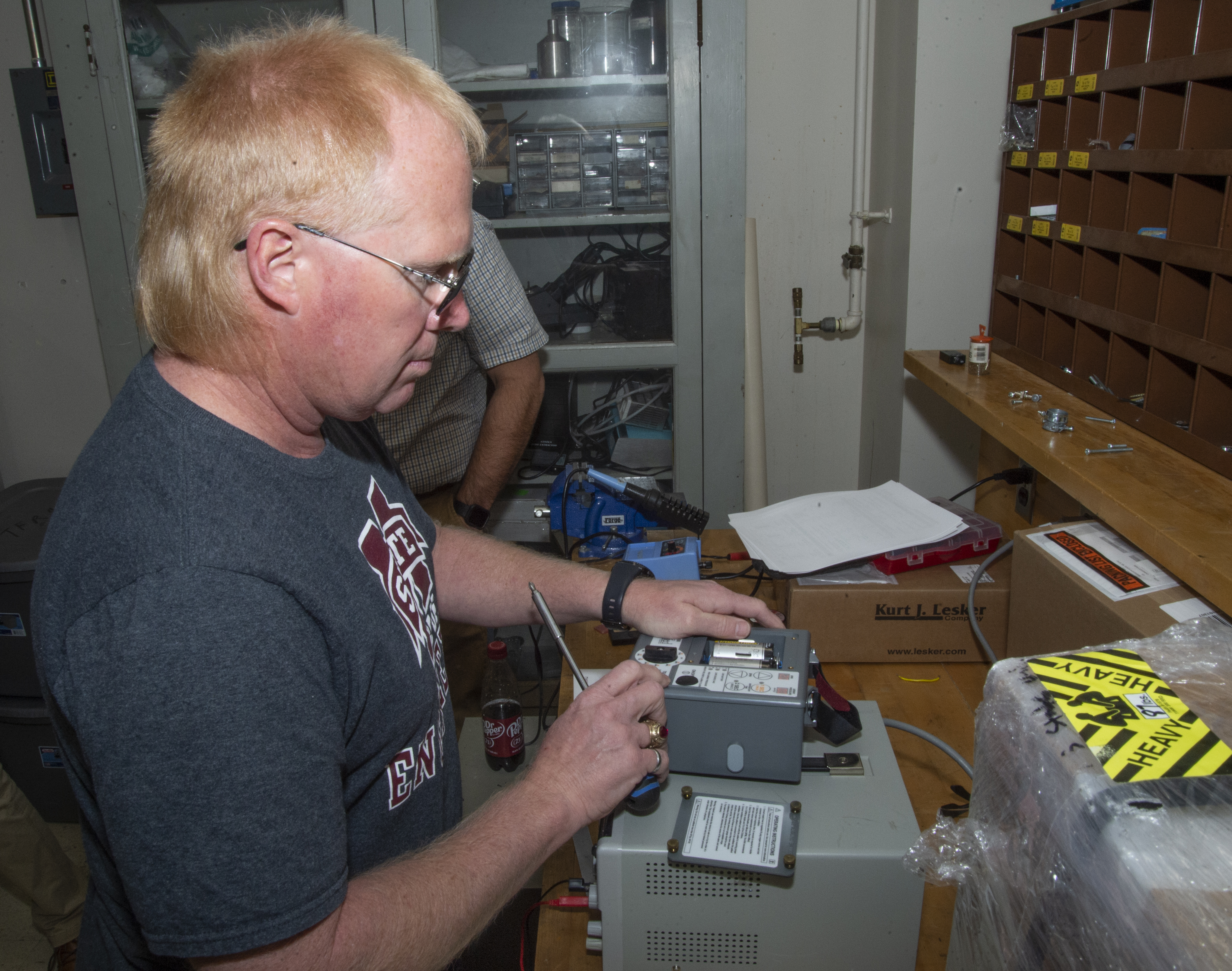 David Wallace works on a ventilator at MSU's High Voltage Lab