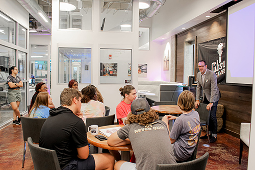 MSU Associate Professor Charles Freeman talks with iCREATE campers in the Center for Entrepreneurship and Outreach.