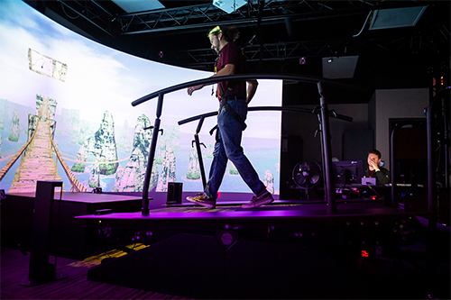 David Saucier, a research engineer in the Athlete Engineering Institute, runs a test on the Motek GRAIL system in the institute’s lab space. The clinical-grade equipment provides the research team with an immersive environment to conduct wide-ranging gait analysis in real time. 