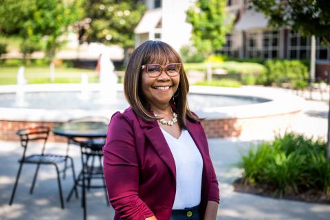 Photo of Tina Davis outside in front of a fountain