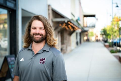 Mississippi State graduate student Stephen Kachelman poses on Main Street in Starkville.