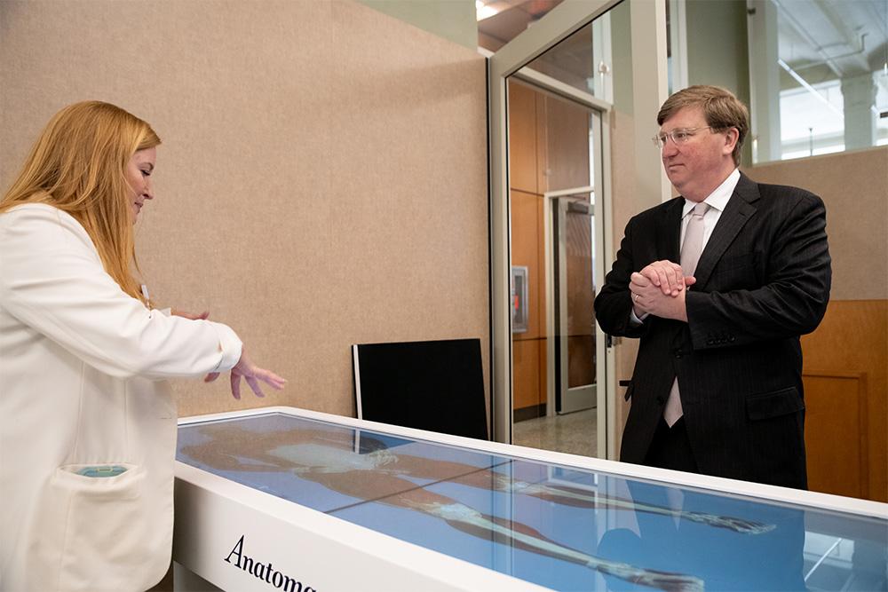 MSU Director of Physician Assistant Studies Shey Washburn demonstrates healthcare education technology to Gov. Tate Reeves during his tour of the Interprofessional Simulation Program at MSU-Meridian.