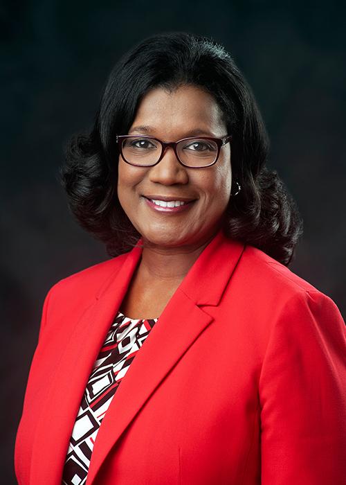 A portrait of Aundrea Self.