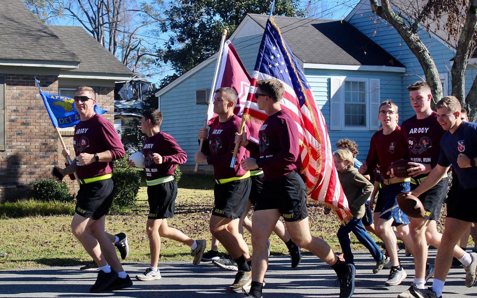 MSU Army ROTC cadets complete the Egg Bowl Run in 2023. The run between the MSU and UM campuses has become a tradition as the two rival schools’ ROTC programs work together prior to the football game to challenge themselves and support a food drive, as well as get fans along the route geared up for gameday. (OPA Photo)
