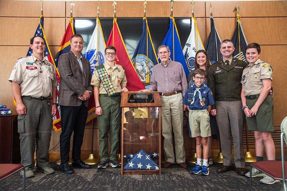 Pictured at the dedication of a new U.S. flag retirement box at Mississippi State’s G.V. “Sonny” Montgomery Center for America’s Veterans at Nusz Hall are, from left Troop 14 Scoutmaster Todd Hamby; MSU Executive Director for Veterans and Military Affairs Andrew Rendon; Robert “Reed” Edwards, who contributed the box as an Eagle Scout project; family friend Louis Jenkins, who helped Edwards; parents Scott and Lydia Edwards; and brothers Jake and Levi (front) Edwards.