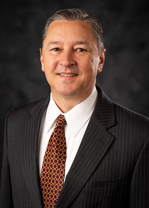 A portrait of John Walters.