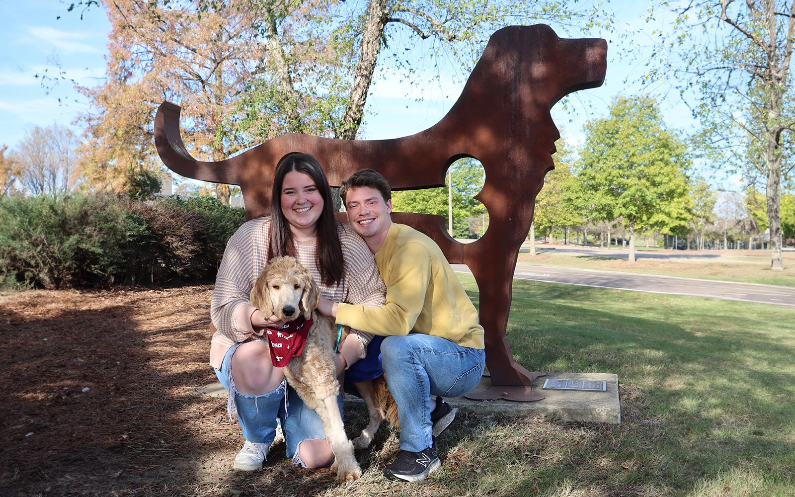Emily Roberts and Dylan McCay celebrate Maple's full recovery. Mississippi State Animal Health Center performed an extensive five hour surgery to put Maple on a path to recovery. (Photo by Amelia Anderson)