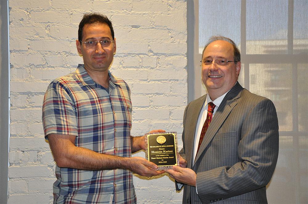 Hossein Karimi, assistant professor of psychology, with College of Arts and Sciences Dean Rick Travis