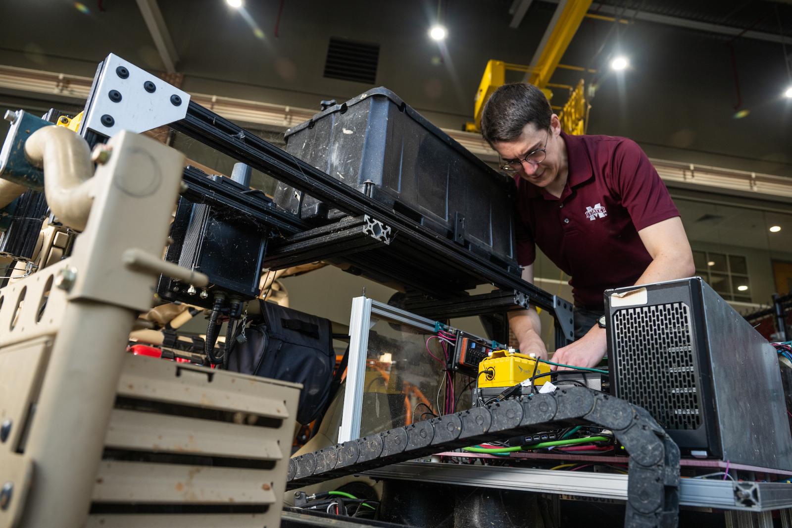 Marc Moore working on an autonomous vehicle