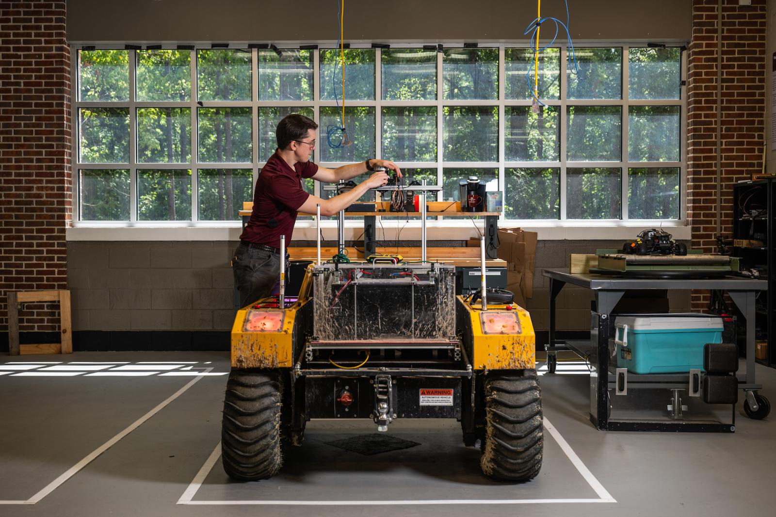 Marc Moore working on an autonomous vehicle