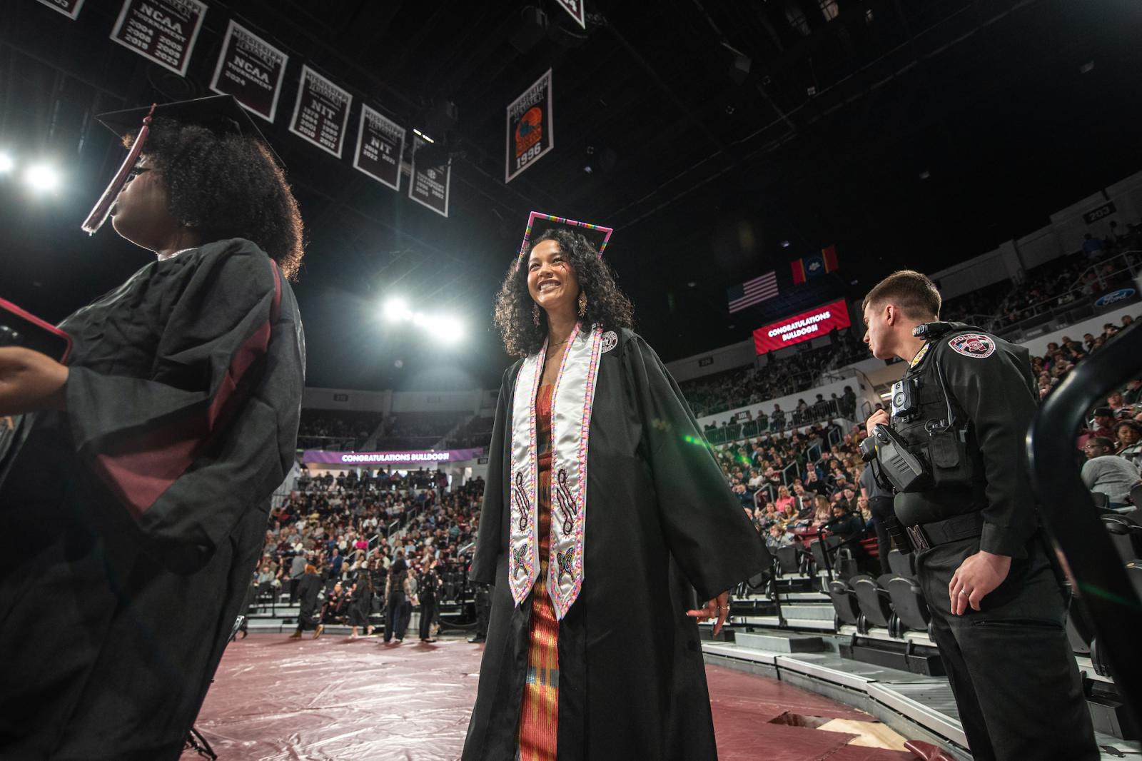 A Mississippi State graduate walks across the stage.