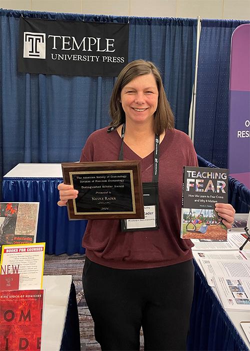 Professor Nicole Rader at the Temple University Press booth at the American Society of Criminology in November.