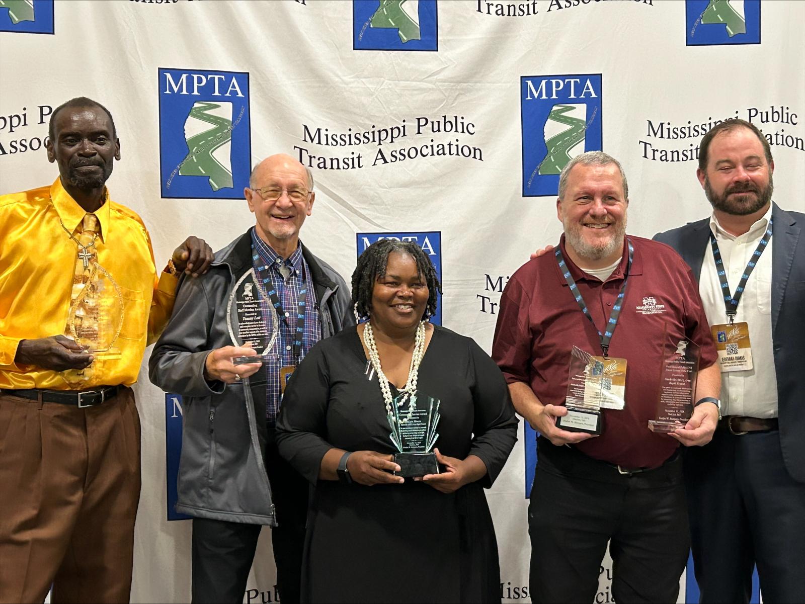 Mississippi State transportation won three driver awards, Rural General Public Transit System of the Year and Innovative Agency of the Year during recent Mississippi Public Association’s conference. From left, S.M.A.R.T. transit operators Theodis Young, Tommy Lott, Joe Lynne Moore; Tom Perkins, assistant director for transit services; and Jeremiah Dumas, executive director of transportation. (Submitted Photo).