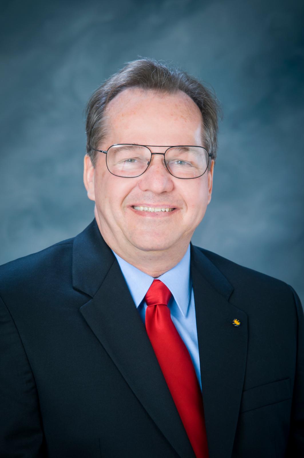 A portrait of Mark A. Novotny.