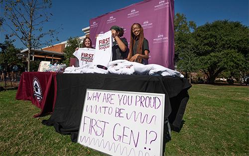 Students celebrate first-generation scholars at a campus tabling event