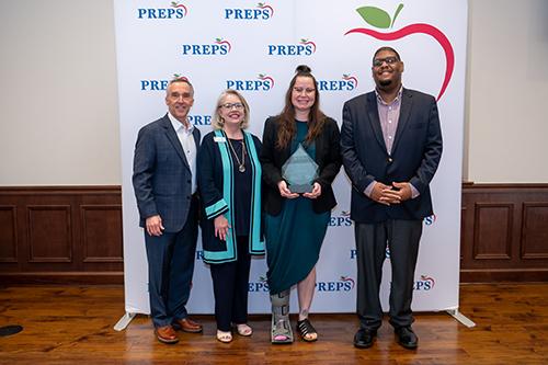 Lindsay Colyer, third from left, poses with, Chuck Beningo, left, William Carey University Program of Research and Evaluation for Public Schools executive director; Pattie Permenter, Mississippi Rural Education Association co-coordinator; and Bradley Long, MREA co-coordinator.