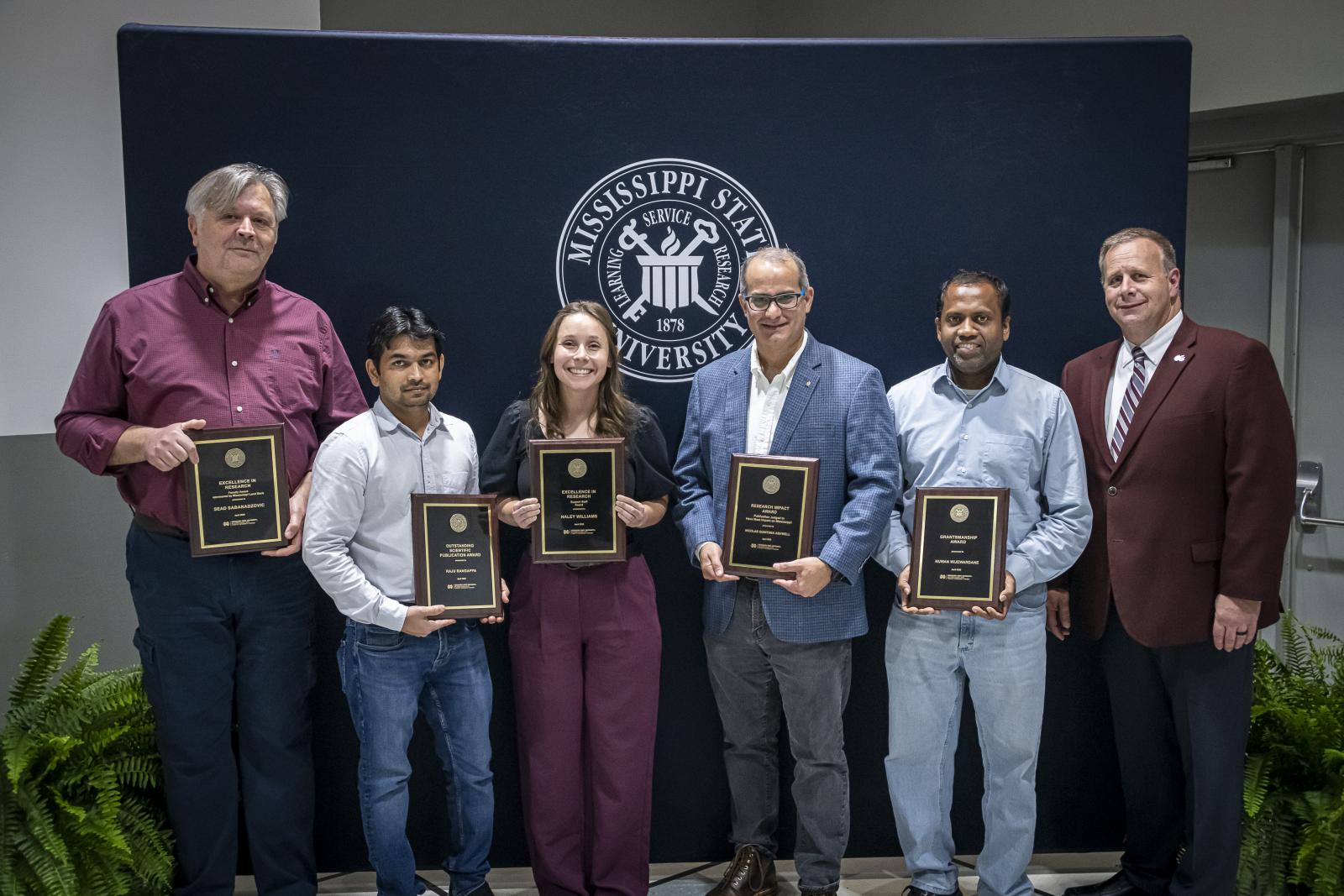 From left, Sead Sabanadzovic, Mississippi Land Bank-sponsored MAFES Excellence in Research Faculty Award; Raju Bheemanahalli Rangappa, Outstanding Publication Award; Haley Williams, Research Support Staff Award; Nicolas Quintana Ashwell, Publication with Most Impact on Mississippi Award; Nuwan Wijewardane, MAFES Grantsmanship Award; and Scott Willard, CALS dean and MAFES director. (Photo by David Ammon)
