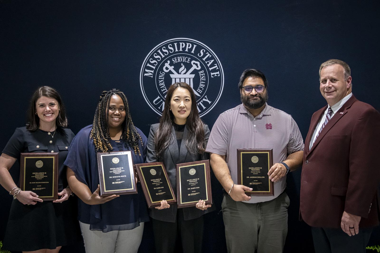 From left, Mary Nelson Robertson, Undergraduate Teaching Award, Lower Division; Shecoya White, Undergraduate Teaching Award, Upper Division; SaMin Han, CALS Teacher of the Year and New Faculty Teaching Award; Jagman Dhillon, Graduate Teaching Award; and Scott Willard, CALS dean and MAFES director. (Not pictured) Aswathy Rai, CALS Excellence in Advising Award. (Photo by David Ammon)