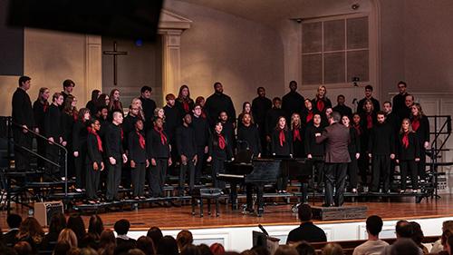 MSU choir members stand during a performance.