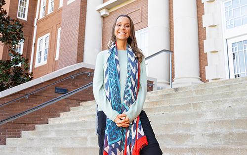 Liza Bondurant is pictured standing outside of a campus building.