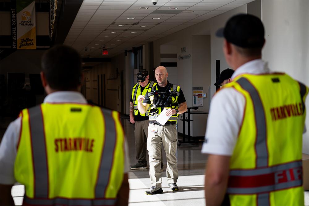MSU Emergency Manager Brent Crocker speaks to first responders participating in an emergency preparedness exercise at Partnership Middle School on June 6.