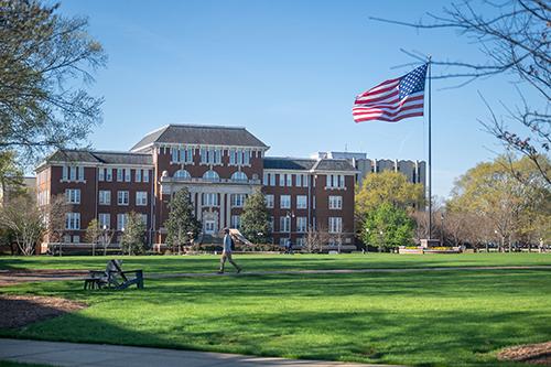 The U.S. flag waves on the Drill Field.