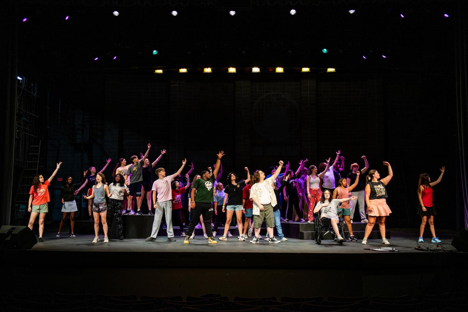 Group of students dancing on stage