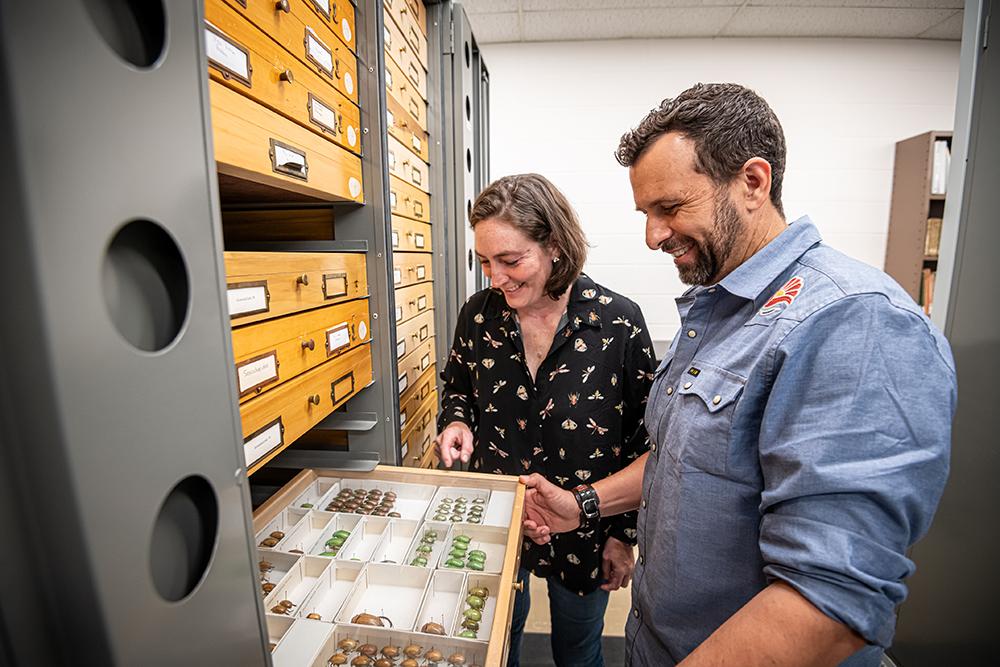 Jennifer Seltzer and JoVonn Hill examine beetles at the Mississippi Entomology Museum.