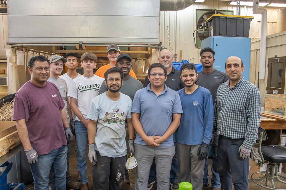 Posing are Ershad Ahmmed, Arun Kuttoor Vasudevan, Mohamed Ibrahim, Aadarsha Lamichhane and Mostafa Mohammadabadi; Second row, from left: Ethan Dean, Dashel Gines, Ian Mayberry, Kevin Ragon, Justin Verner; Back row, from left: Richard Sanchez and Harrison Ragon.