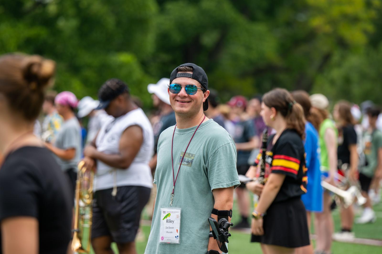 A band student smiles during a practice session.