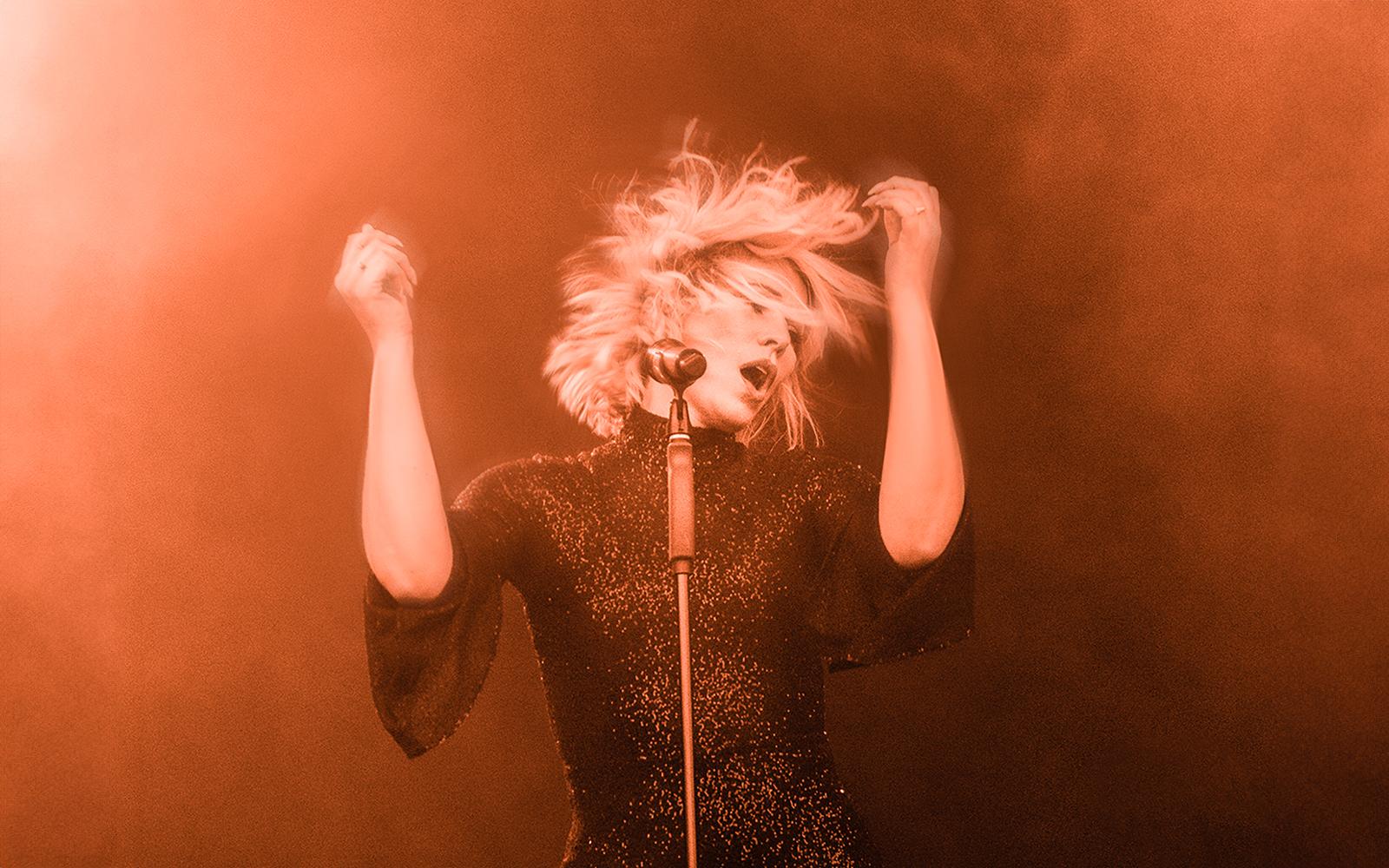 Woman singing in microphone