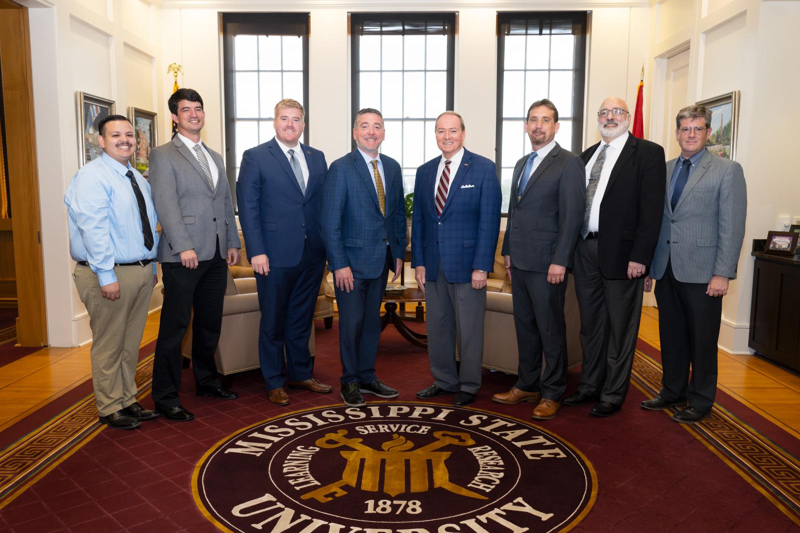 Celebrating a formal partnership with the Aug. 18 MOU signing are, from left, ECCC Culinary Arts Instructor Chef Enoc Reynoso; ECCC Director of Career and Technical Education Cody Spence; ECCC Vice President of External Relations Lucas Calvert; ECCC President Brent Gregory; MSU President Mark E. Keenum; MSU Reed Family Endowed Professor Wes Schilling; MSU Department of Biochemistry, Nutrition and Health Promotion Professor and Head Daniel Peterson; and MSU College of Agriculture and Life Sciences Assistant