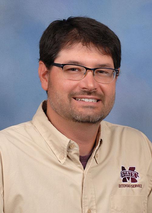 A studio portrait of Eric Stafne.