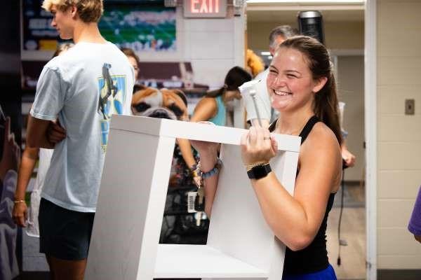 A student moves into a residence hall
