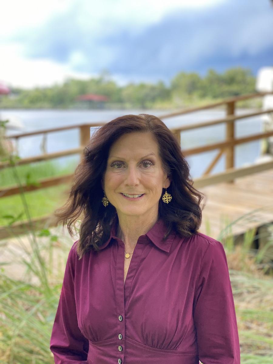 Woman in maroon shirt
