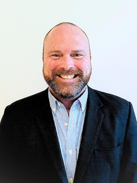 man in black suit on white background